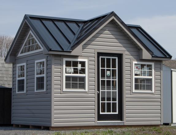 10x12 Custom Victorian Deluxe Storage Shed with vinyl siding, standing seam metal roofing, and additional windows