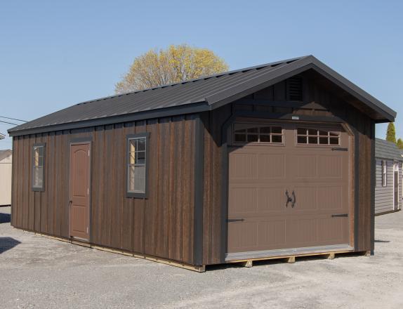 12x28 Peak Roof Garage Building with Ebony LP Board N Batten Siding, Metal roofing, and windows in the overhead door