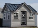 10x12 Custom Victorian Deluxe Storage Shed with vinyl siding, standing seam metal roofing, and additional windows