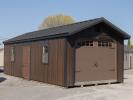 12x28 Peak Roof Garage Building with Ebony LP Board N Batten Siding, Metal roofing, and windows in the overhead door